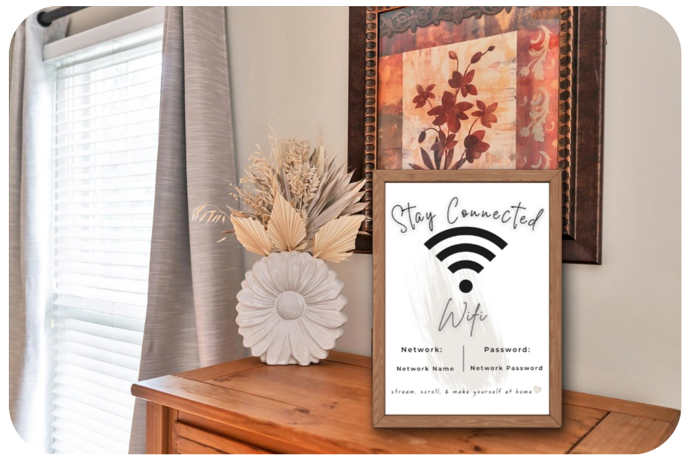 WiFi Password sign for Airbnb displayed framed on a bedroom dresser