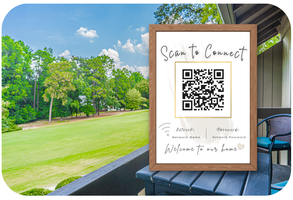 QR Code Airbnb sign displayed framed on a balcony overlooking a golf course